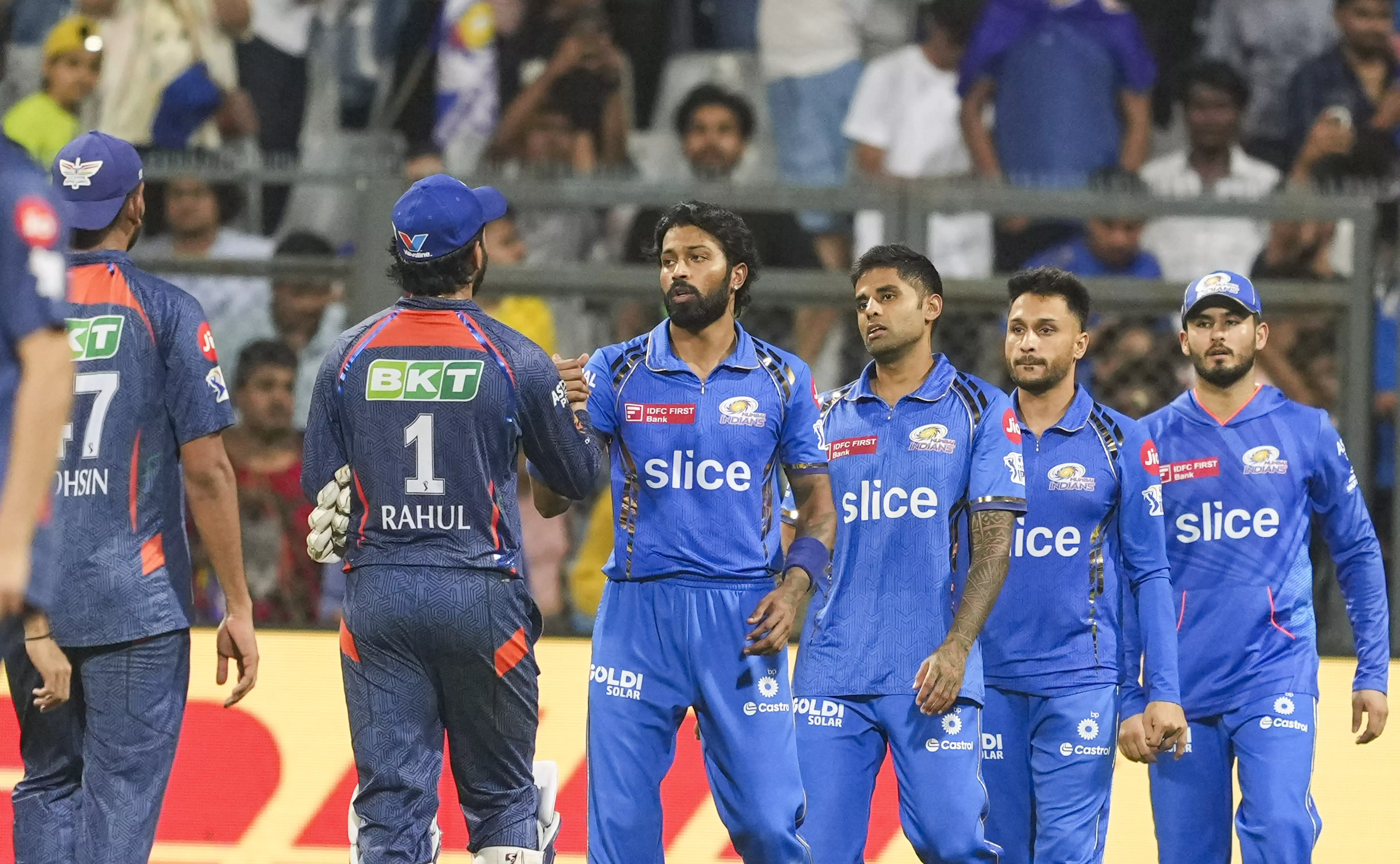 Lucknow Super Giants and Mumbai Indians players greet each other at the end of the match at the Wankhede Stadium in Mumbai on Friday. PTI Photo