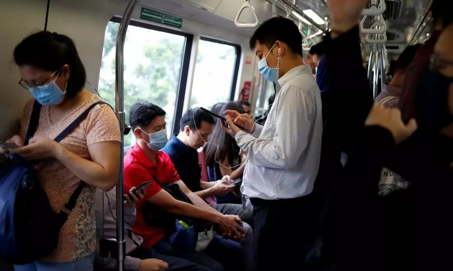 New COVID-19 wave sweeps Singapore, minister advises wearing of masks