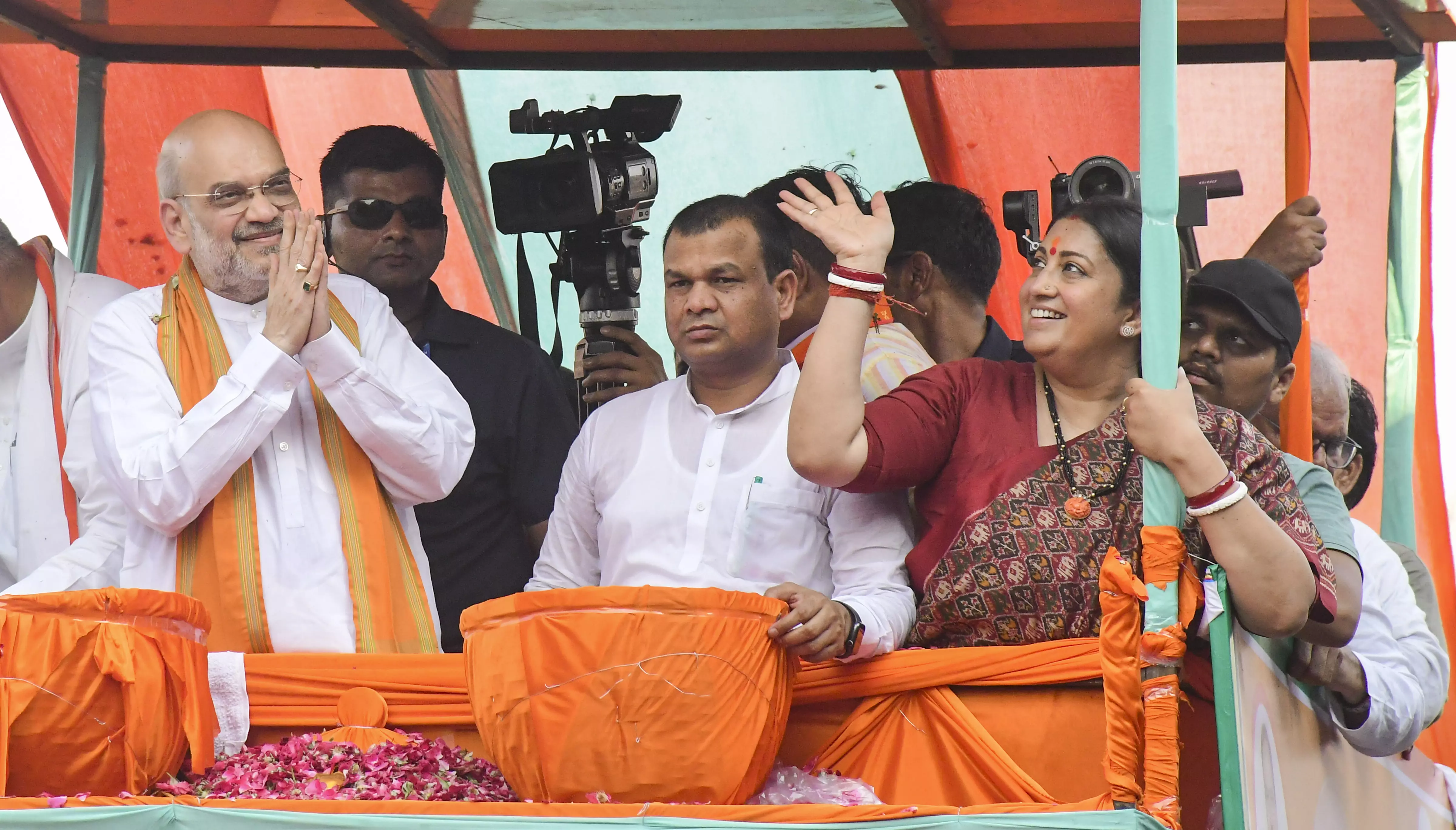 Union home minister Amit Shah with Union minister and BJP candidate from Amethi constituency Smriti Irani and others during an election roadshow for the Lok Sabha polls, in Amethi district, on May 18, 2024. Photo: PTI
