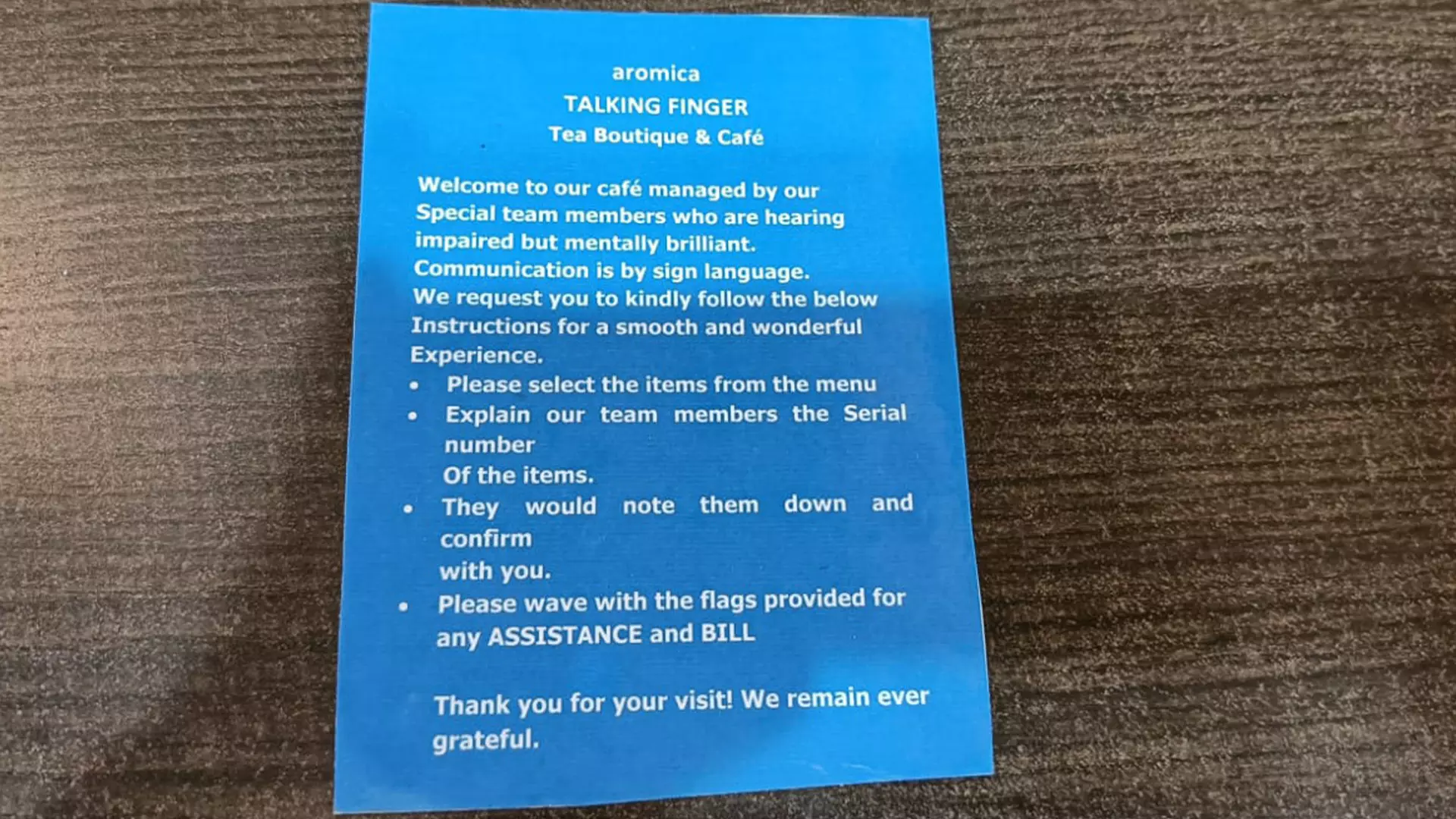 The blue-coloured card informs tea lovers about the uniqueness of the cafe. 