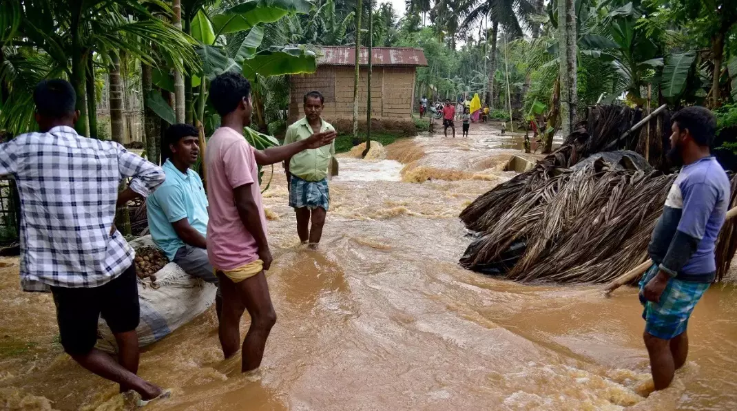 People in Assam stayed without power for days, amid damaged houses and roads. Photo: PTI