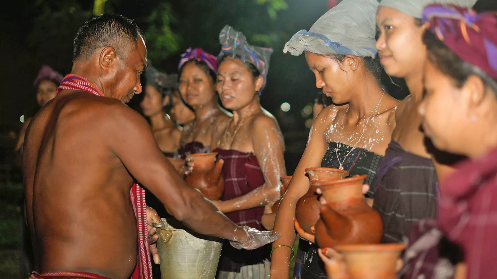 The Baibra smear their bodies with a concoction of rice powder and Choko (traditional liquor) before proceeding to perform Bar Nak-Kai (conquering of the fire) ritual.