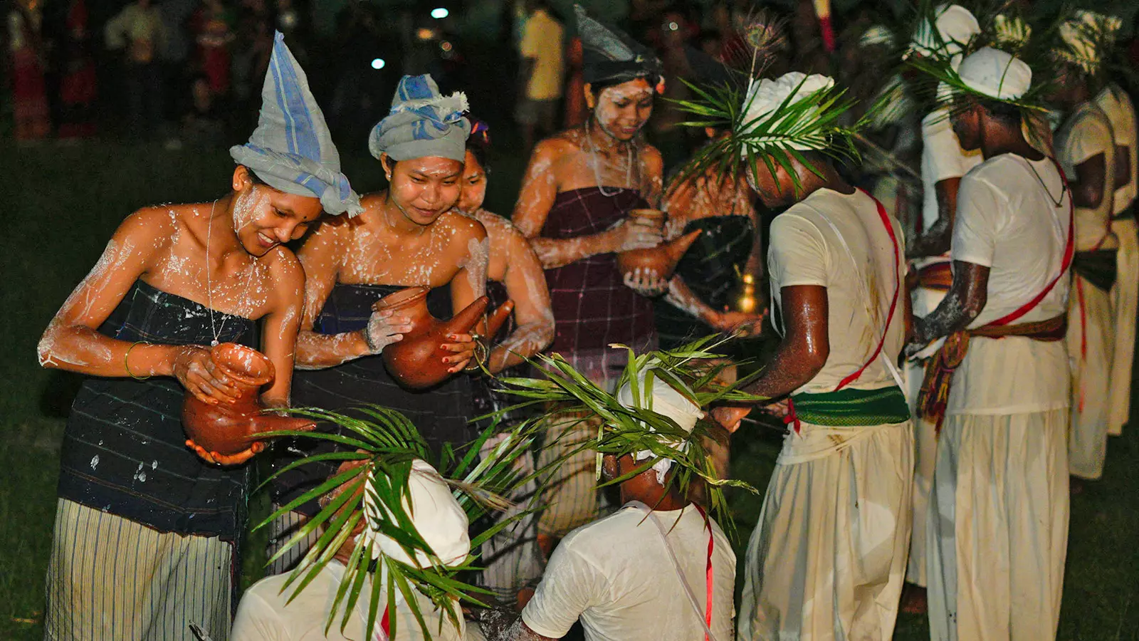 Girls offer traditional liquor to the male Baibra after performing Bar Nak-Kai dance.