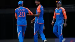 Indias Arshdeep Singh (centre) celebrates a wicket with Axar Patel (left) and Suryakumar Yadav