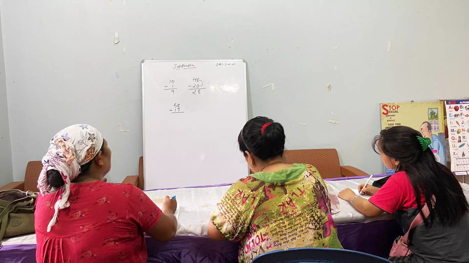 Women learn to do subtraction. Photos: Special arrangement