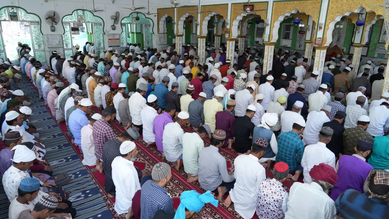 Indian Muslims offer Zuhr (afternoon) namaz at a mosque