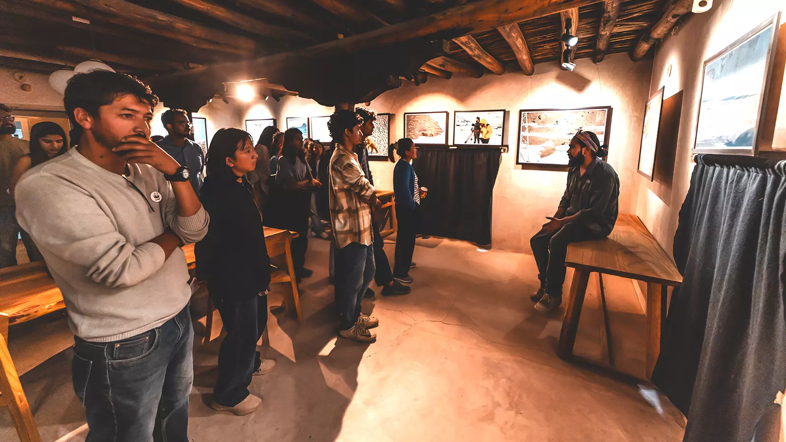 Karamjeet Singh explaining his photographs to the audience from Drenmo Odyssey Exhibition.