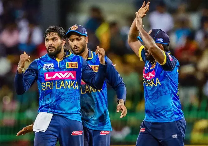 Lanka players celebrate after Hasaranga takes a wicket. Photo: ICC/X