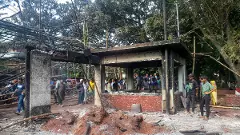 People gather in front of the house of former President Sheikh Mujibur Rahman, father of Prime Minister Sheikh Hasina, in the aftermath of the prime ministers resignation, in Dhaka, Bangladesh, on Wednesday. PTI Photo