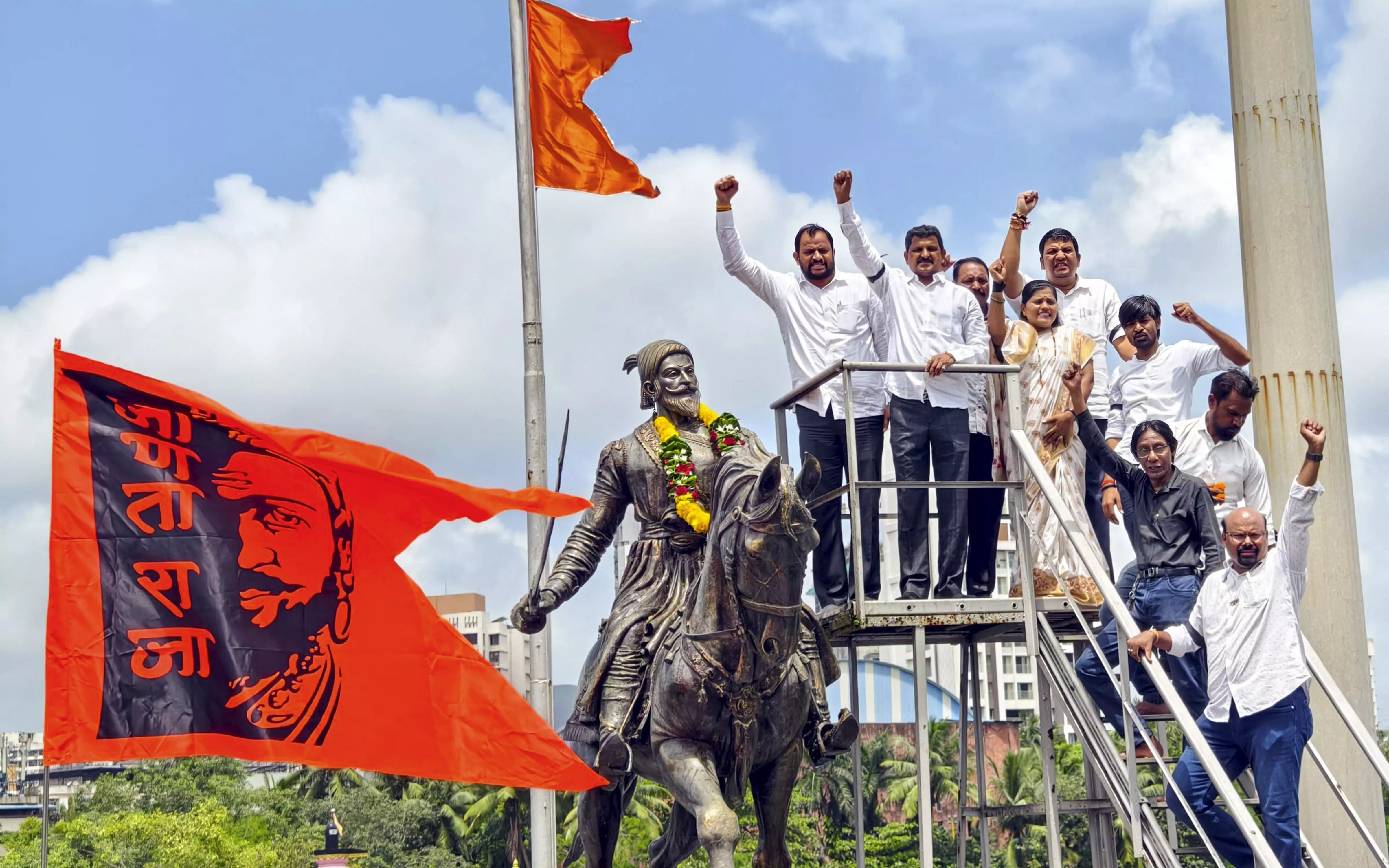 Members of Maratha community stage a protest near the statue of Chhatrapati Shivaji Maharaj against the recent collapse of Malvan. PTI Photo