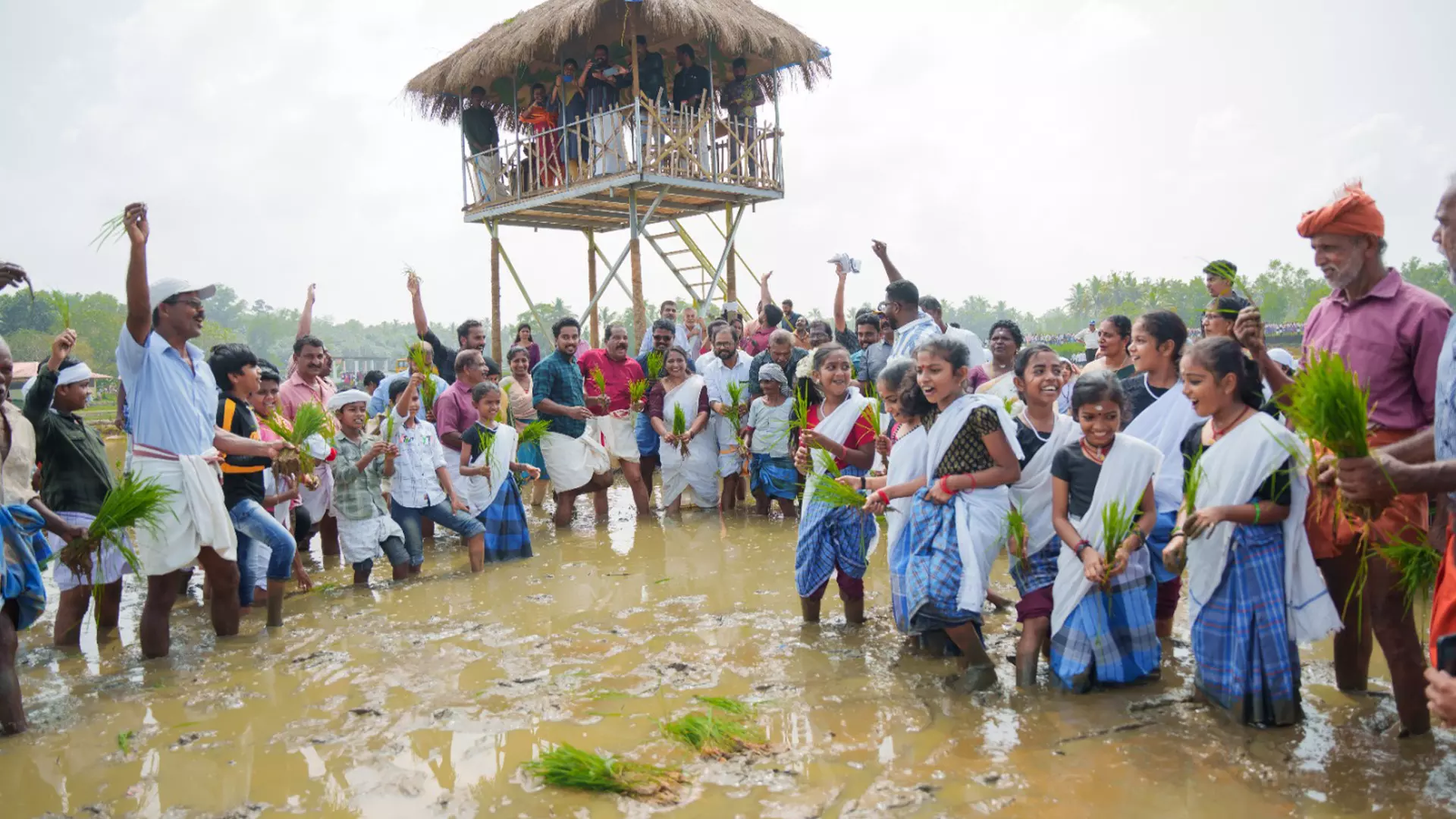 Farmers and their families enjoying with their harvest in Pirappamankadu.