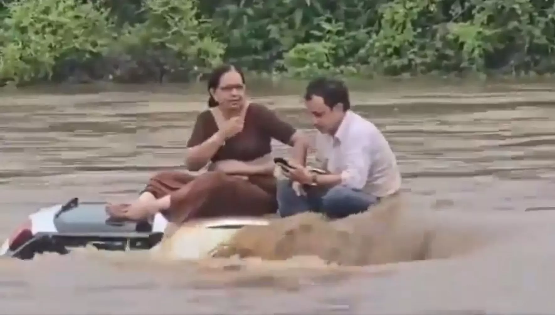 Gujarat: Couple spends 2 hours on roof of car swept away by river, rescued