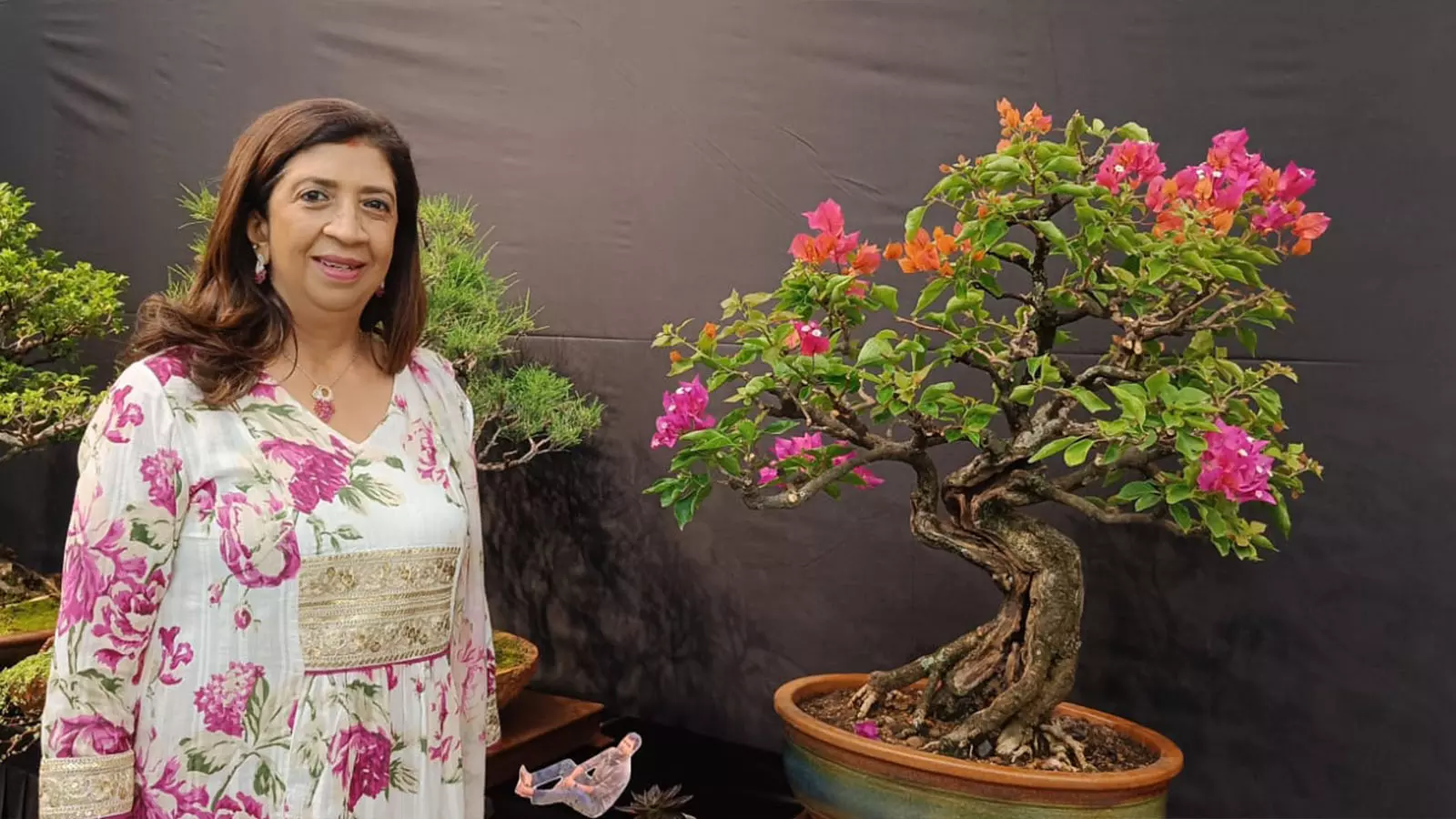 Champa Kabra poses with her 60-year-old bougainvillea plant inherited from her aunt. 