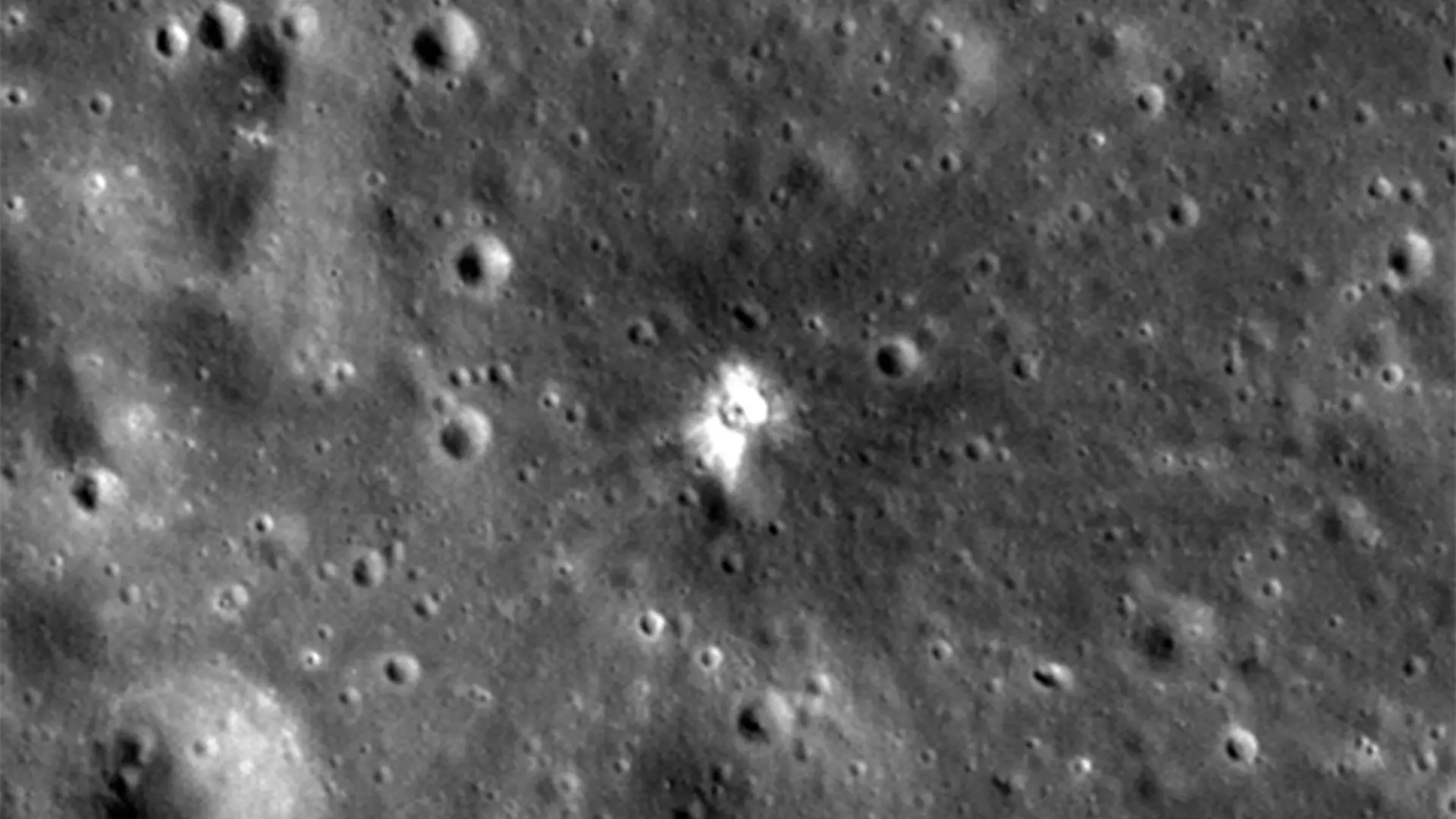 Before and after the collision: The silver-like bright spot is the impact crater. Due to constant solar radiation, the top layer of the regolith, lunar soil, is dark. The inner regolith is protected from solar radiation, and the impact ejects it and brings it to the top, thus making the fresh crater shiny. 