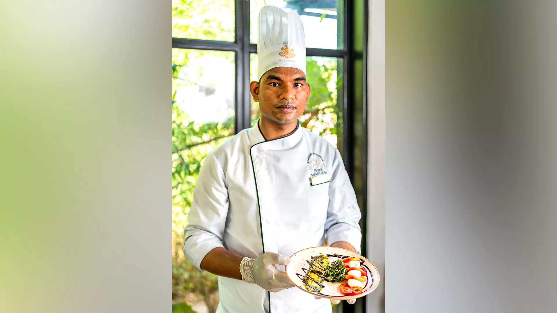 Tej Bahadur, F&B Executive at Bori Lodge, presenting a unique dining experience with gourmet Mahua-infused creations, blending tradition with innovation.