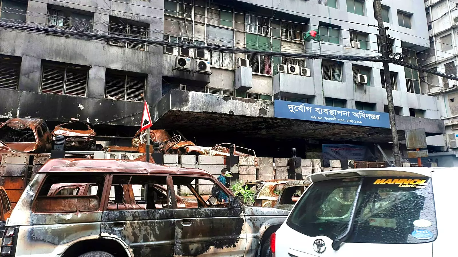 Vehicles that were set ablaze by protesters in Bangladesh. The fires have died out since but families whose members have been missing are yet to find peace and closure. Photos: Samir K Purkayastha