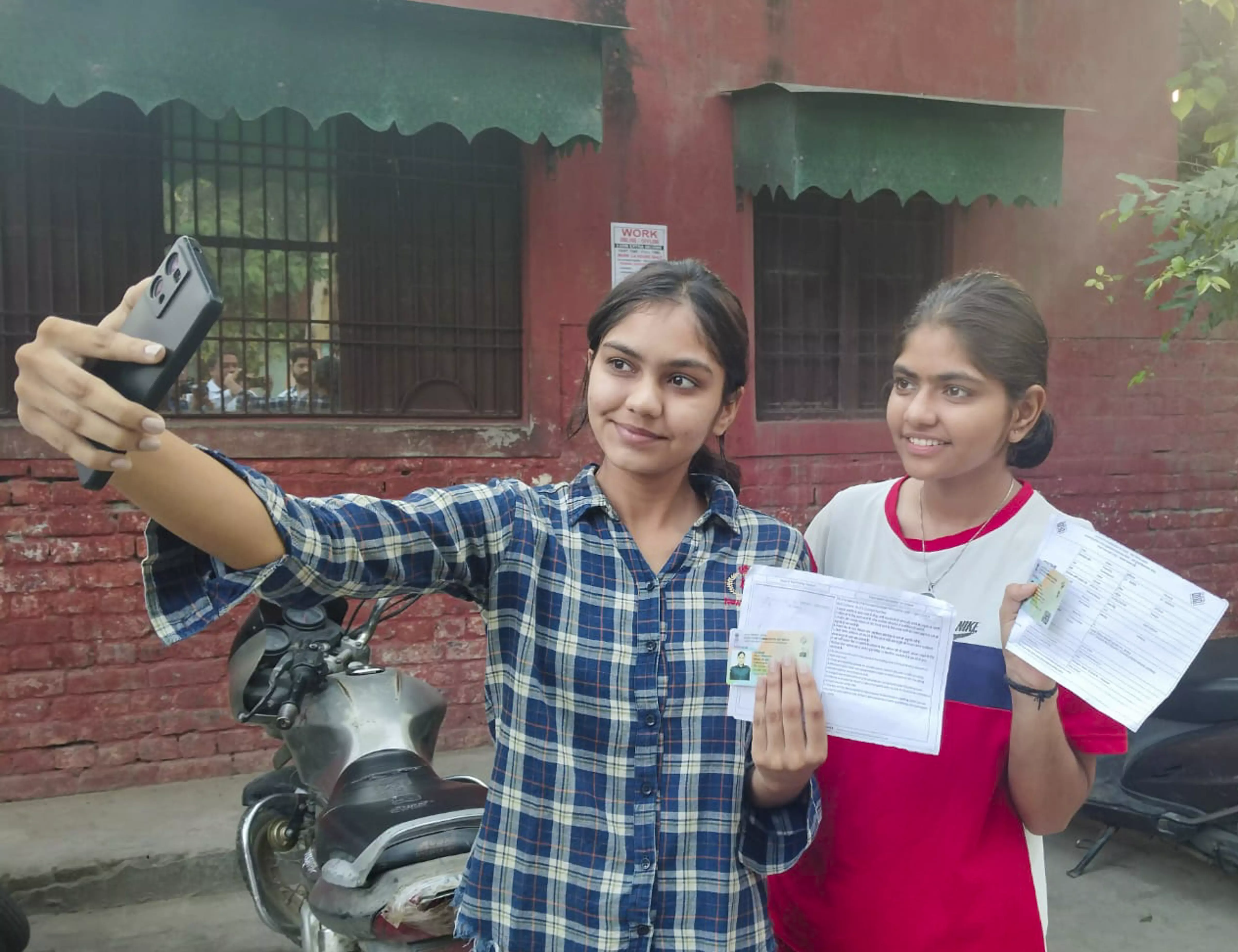 First time voters take a selfie at a polling station during the Haryana Assembly elections in Kaithal on October 5. Photo  PTI