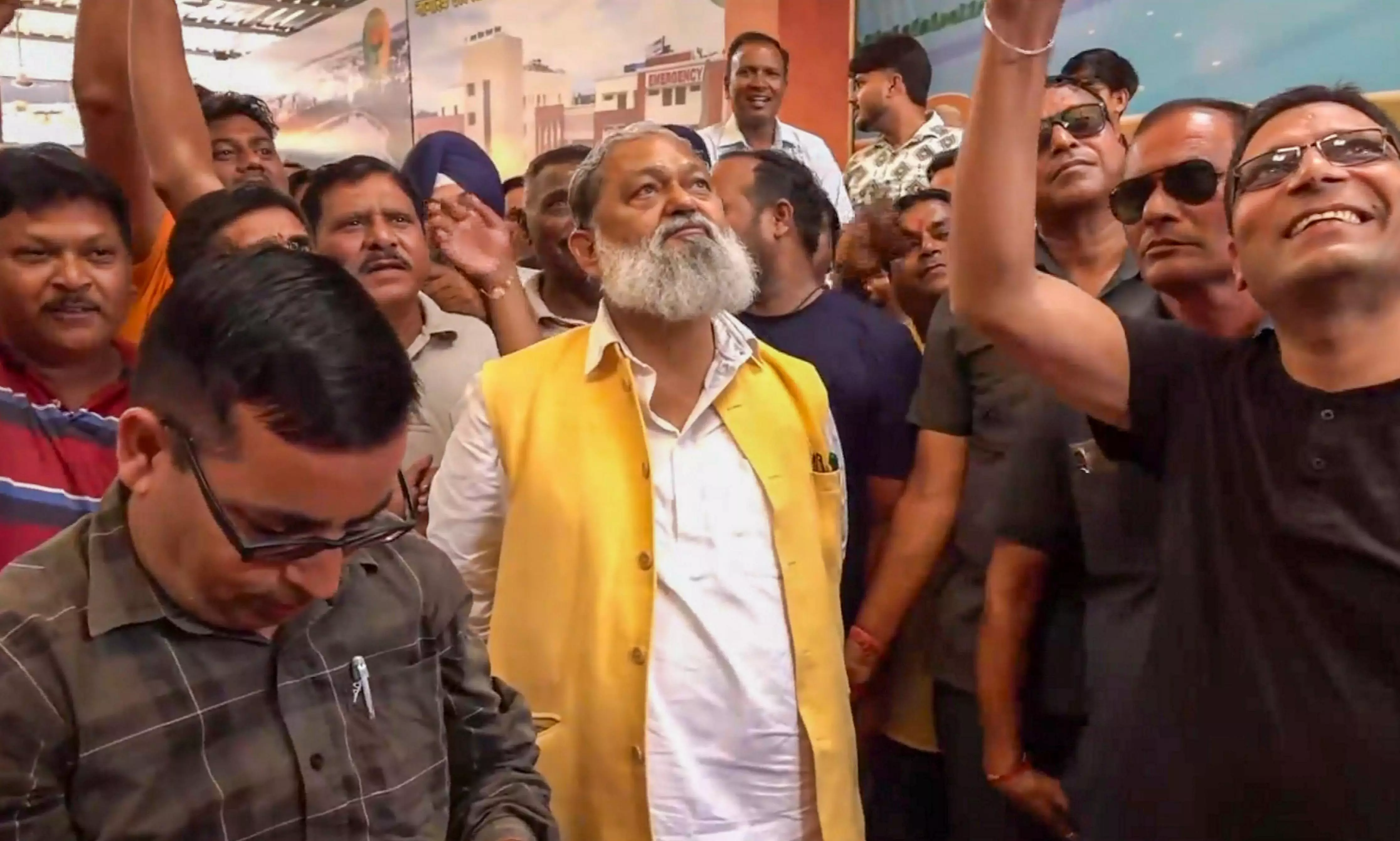 BJP leader Anil Vij monitors Haryana Assembly poll results with party workers, in Ambala, Tuesday, Oct. 8, 2024. (PTI Photo)