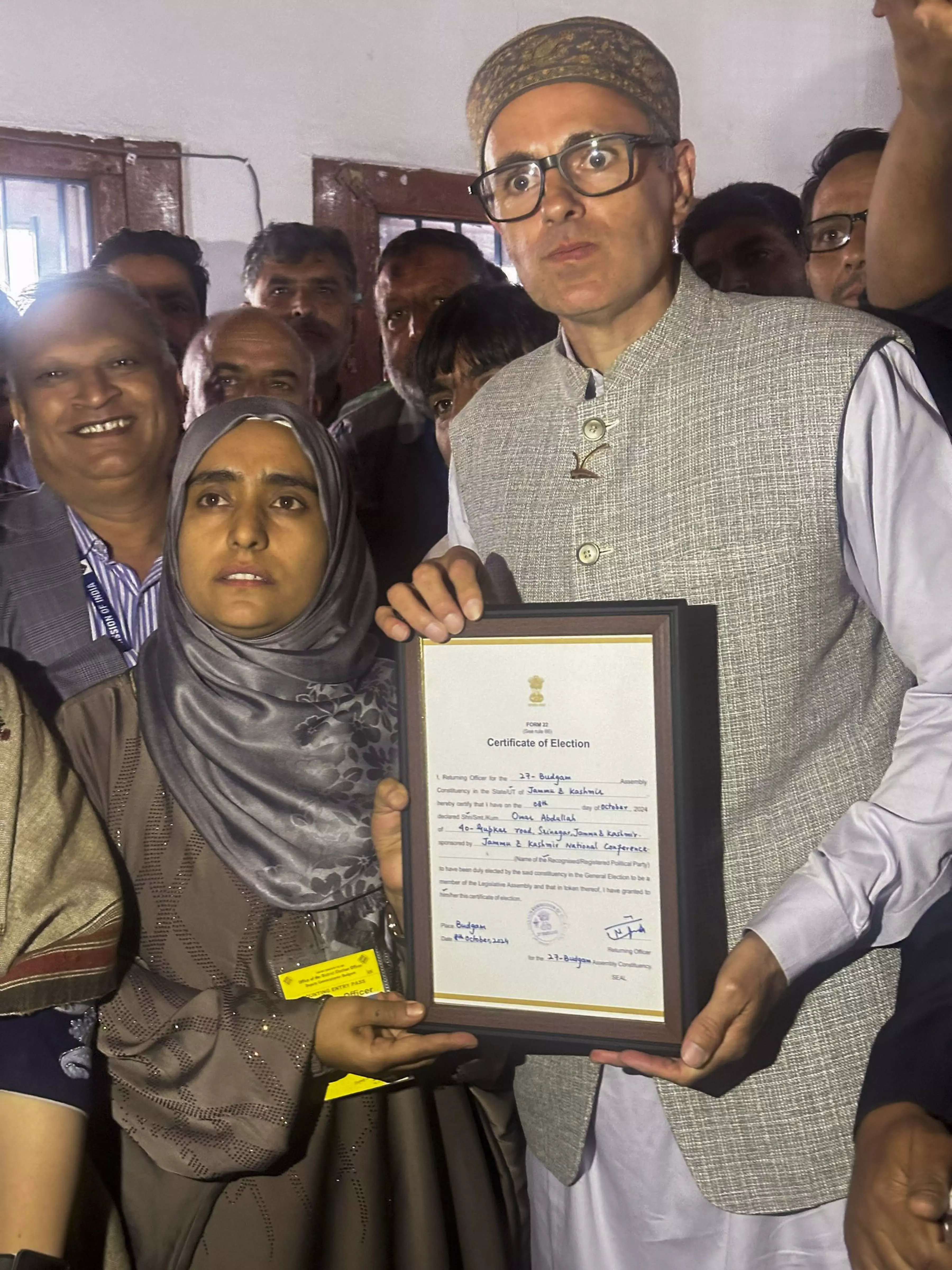 Jammu and Kashmir National Conference Vice President Omar Abdullah receives the victory certificate after winning from Budgam constituency in the J-K Assembly elections, in Srinagar. PTI