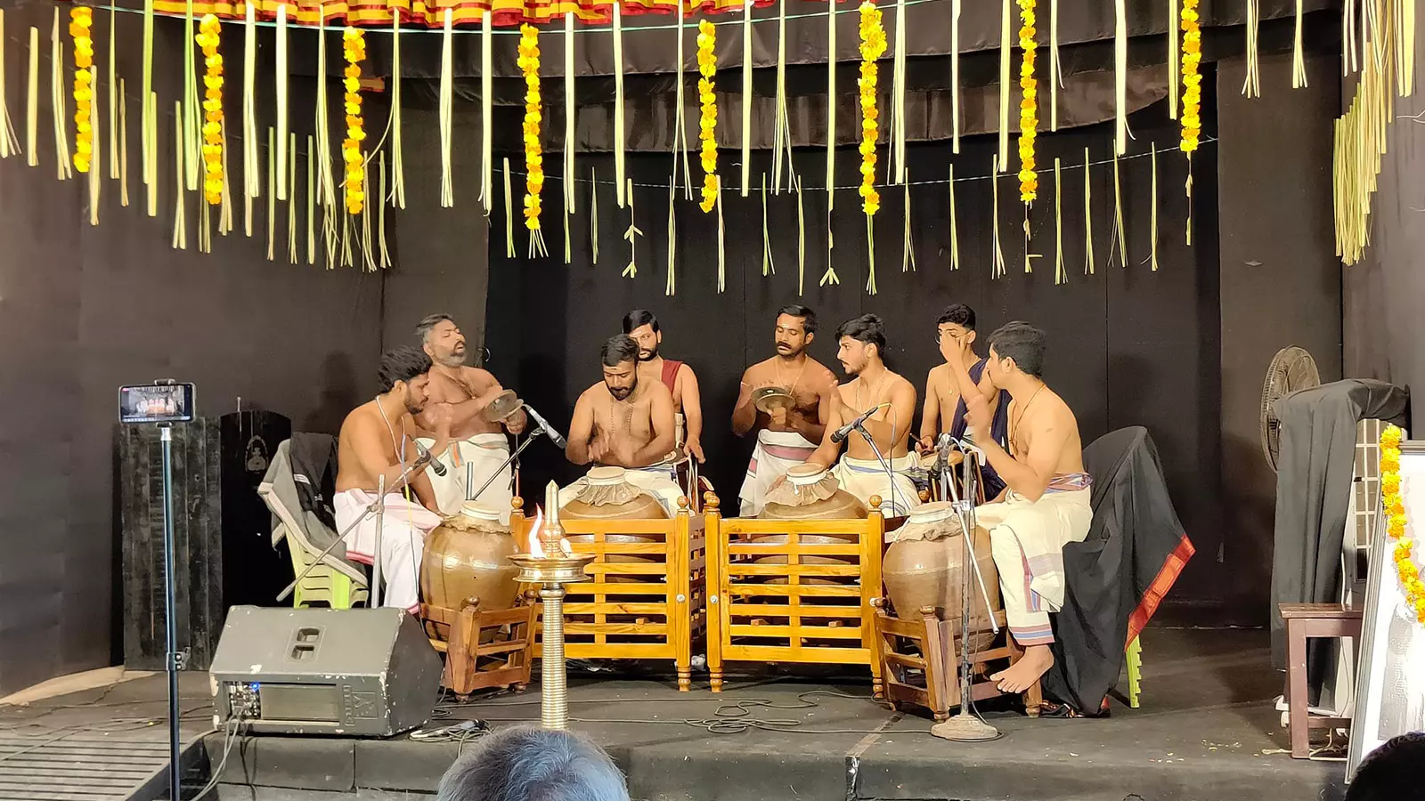 Artists perform Mizhavu as part of the festival.