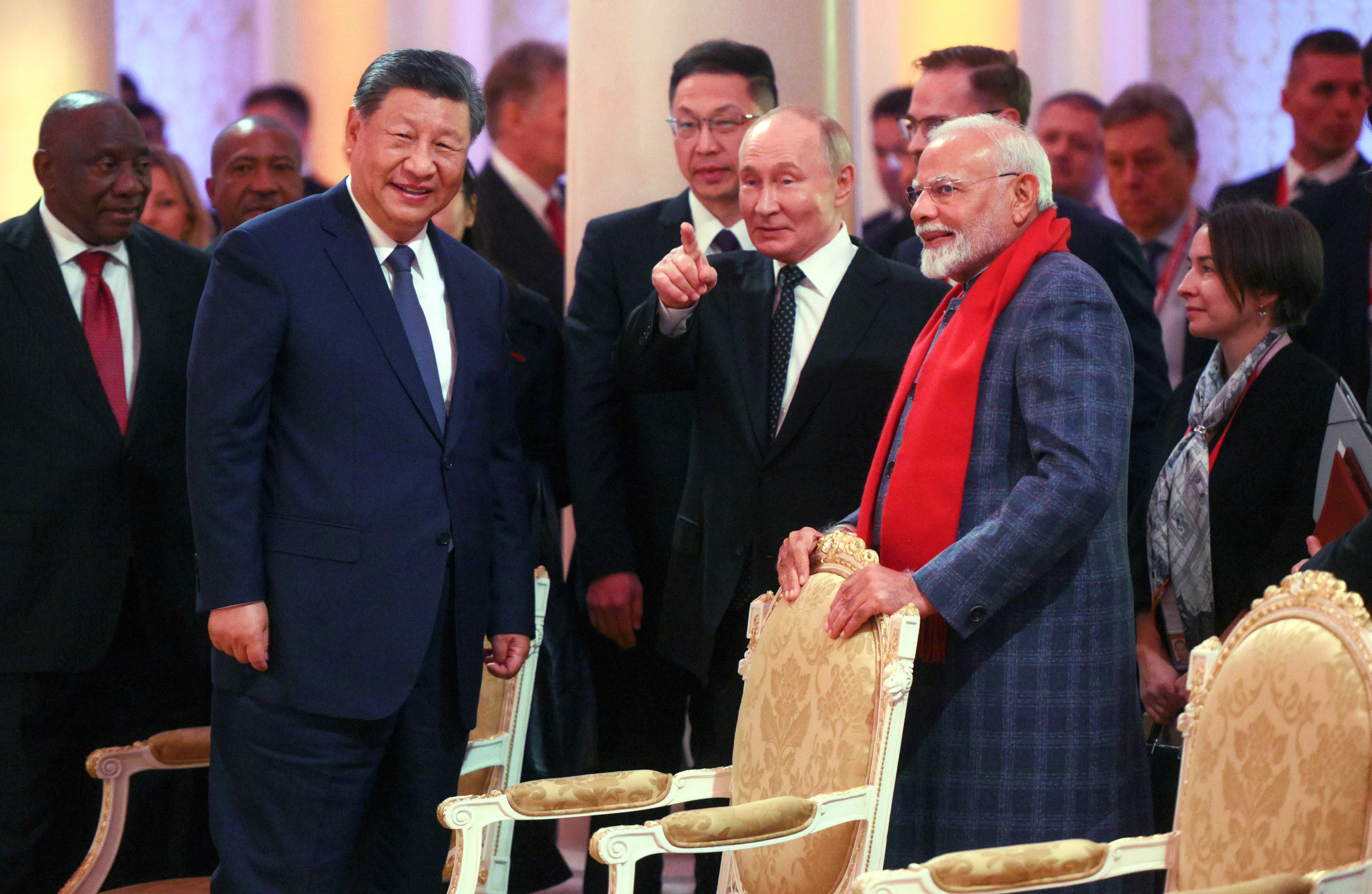 PM Narendra Modi shares a light moment with President of Russia Vladimir Putin and President of China Xi Jinping during a concert ahead of an informal dinner for the heads of BRICS delegations held as part of the 16th BRICS summit in Kazan on Tuesday | PTI