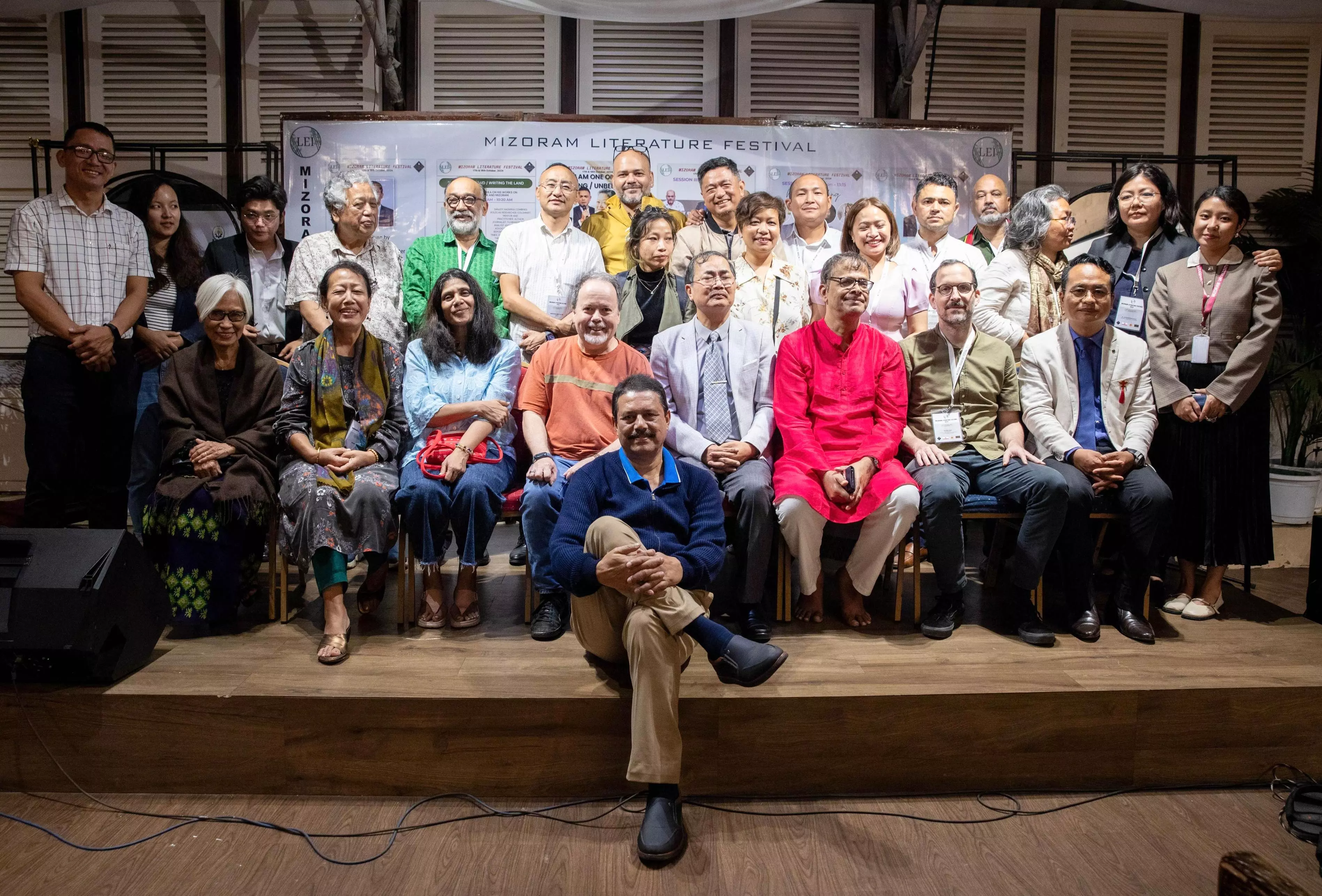 At the LEI - Mizoram Literature Festival 2024, organising committee members pose with all the resource persons and panellists for a picture.