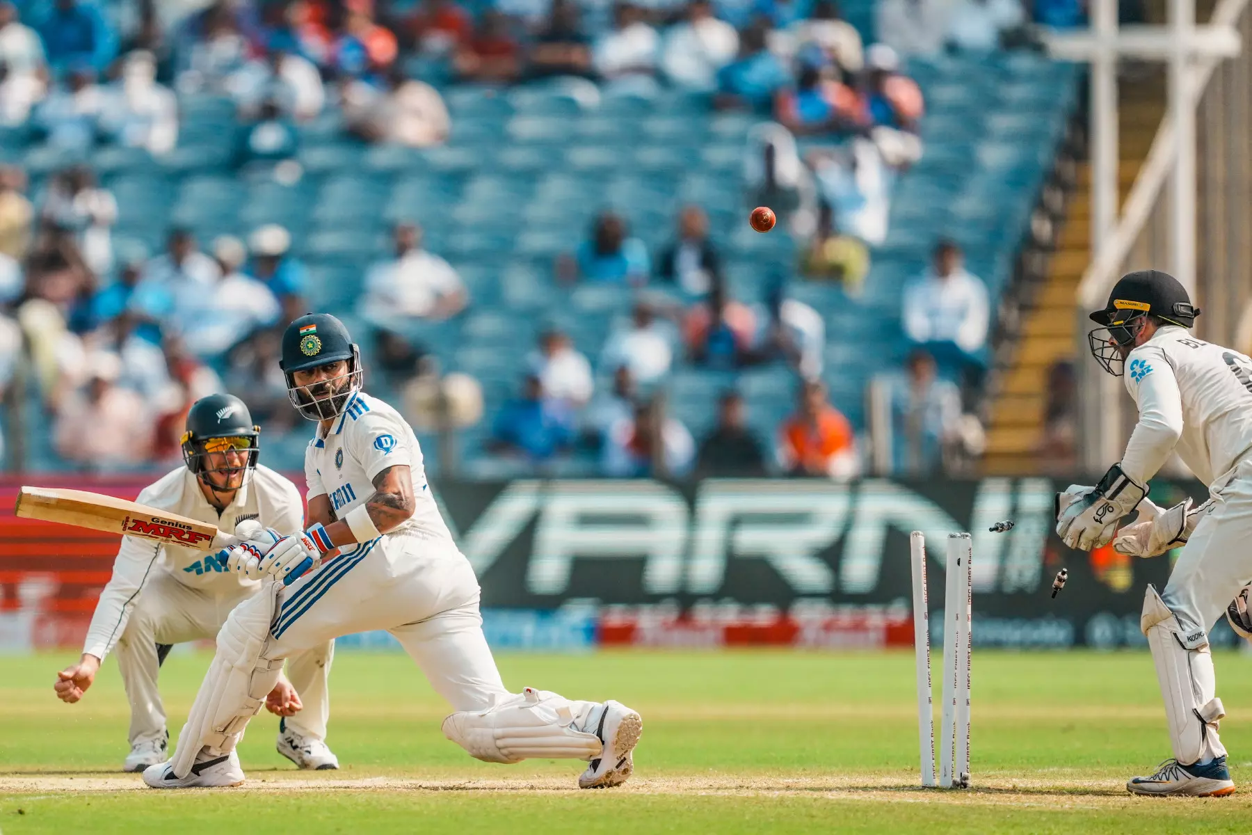 Indias Virat Kohli is bowled by New Zealands Mitchell Santner