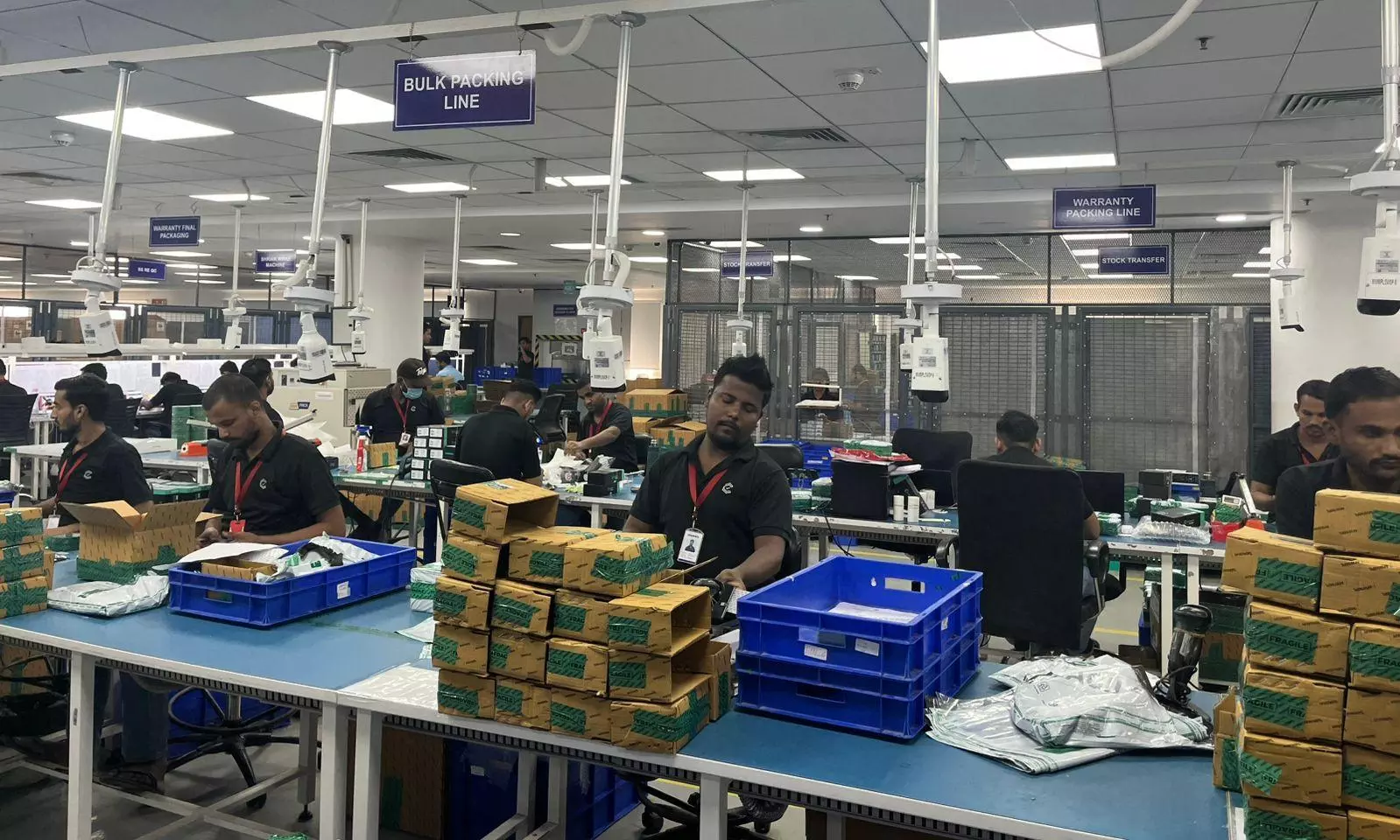 Staff manning their workstations at the Cashify facility in Noida | The Federal