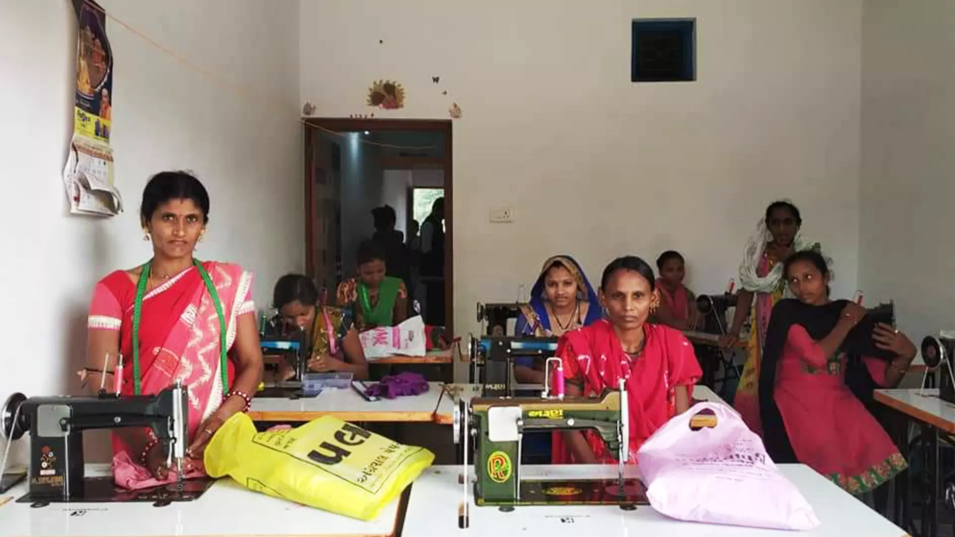 Kavita (standing) who lost her life this month before she could be carried to an ambulance.