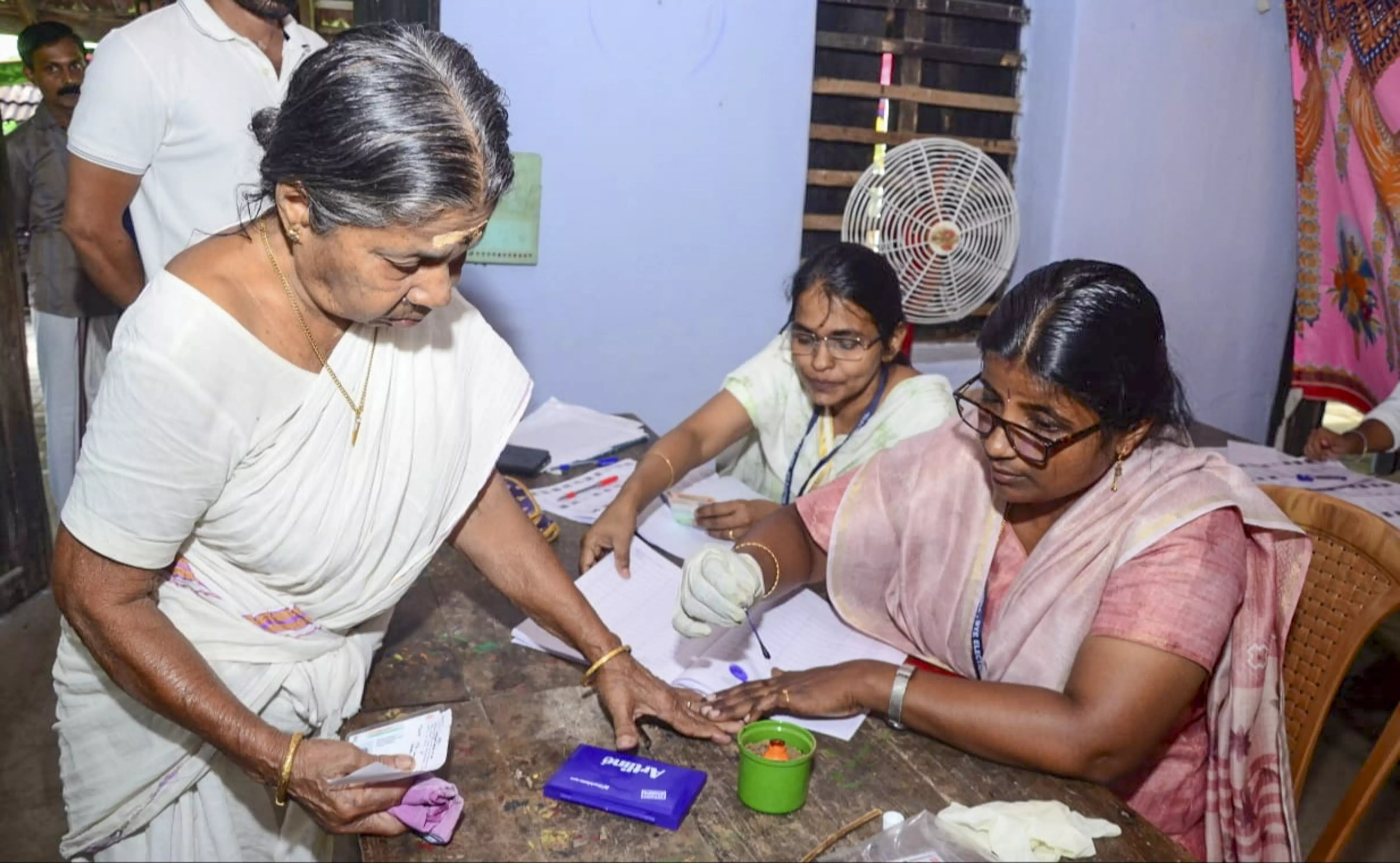 A voter gets her finger marked with indelible ink before casting her vote during Keralas Palakkad Assembly constituency bypoll | PTI 