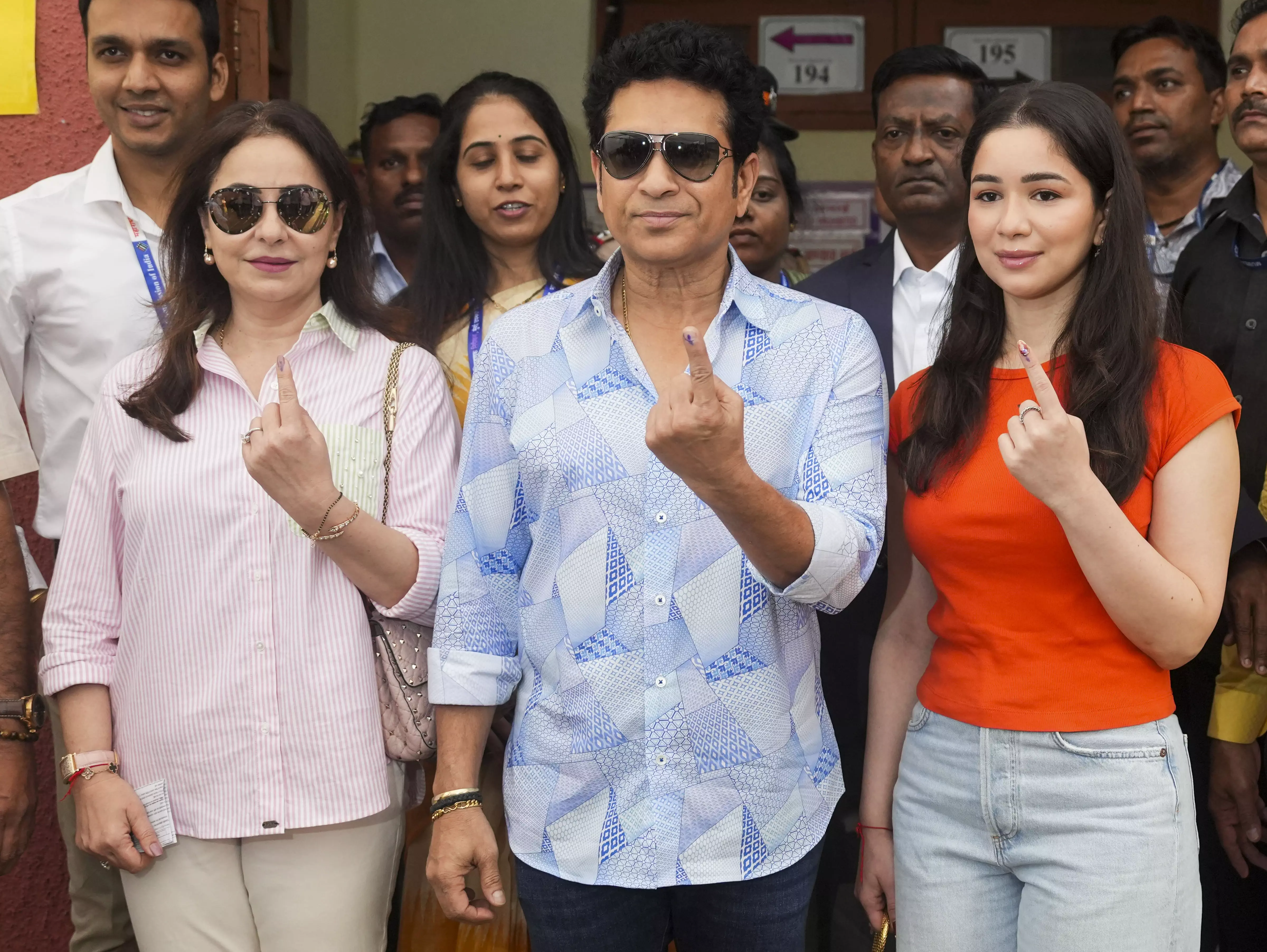 Former cricketer Sachin Tendulkar, wife Anjali and daughter Sara show their inked fingers after casting votes at a polling station in Mumbai | PTI 