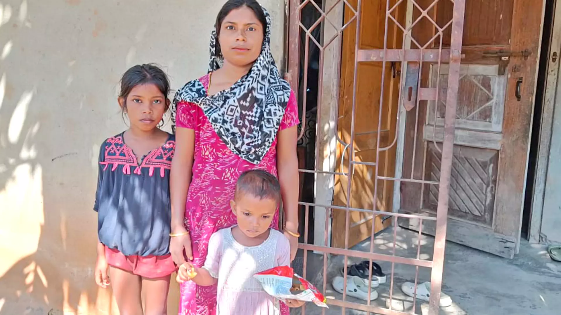 Mihiron Begum poses with her two daughters.