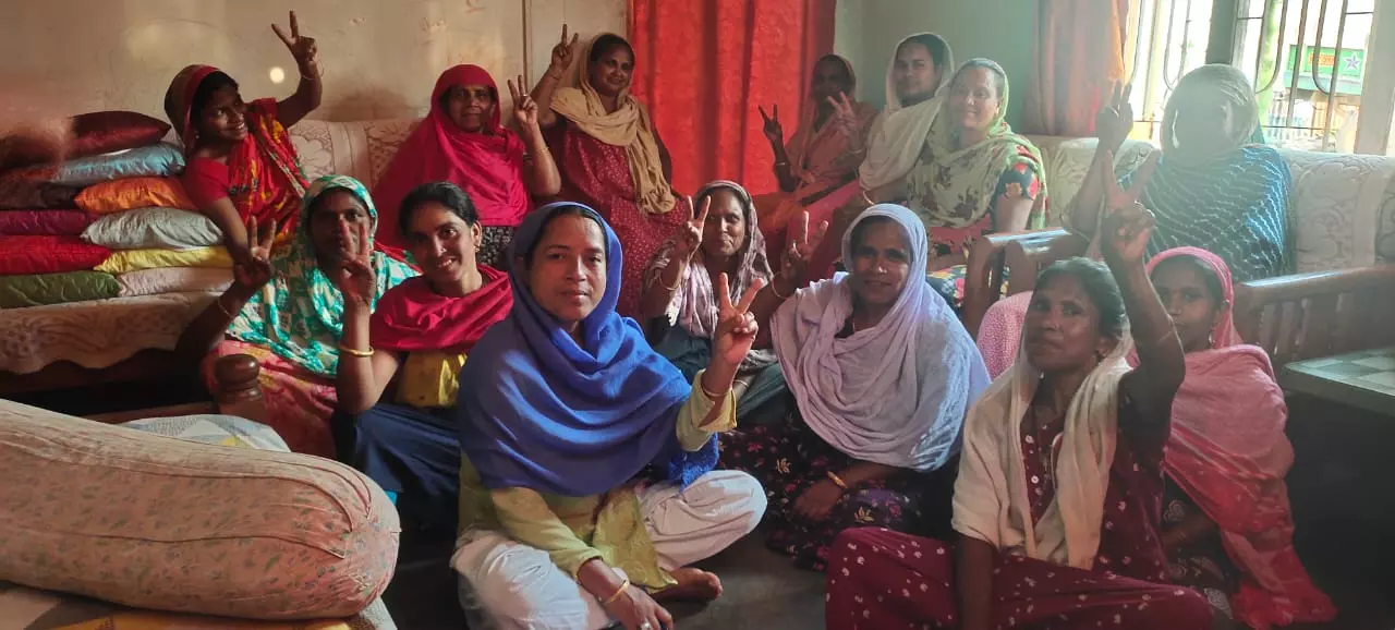 Domestic workers of Guwahati, Assam pose for a picture after one of their regular meetings.