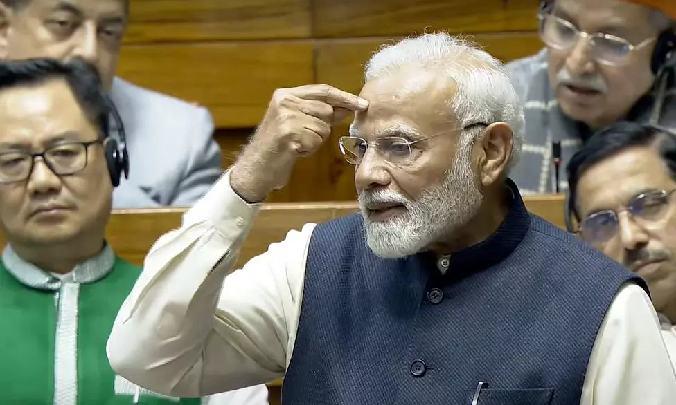 Prime Minister Narendra Modi speaks in the Lok Sabha, during a discussion on the Constitution.