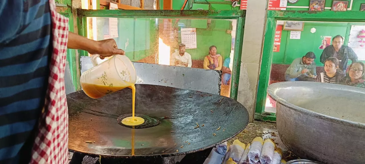 As eggs get fried on the wok, guests can see their food being cooked in the open kitchen.