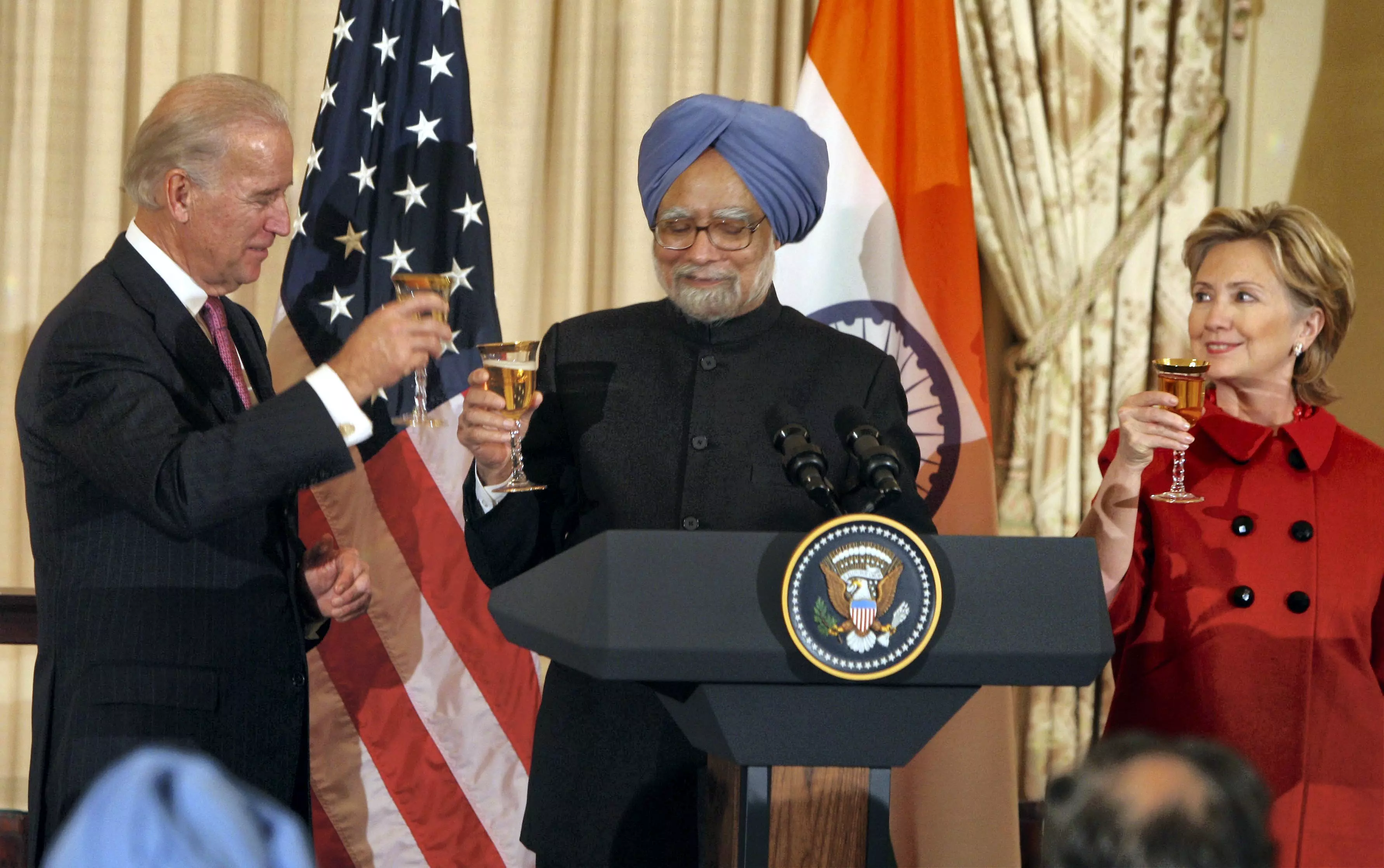 In this November 25, 2009 file image, Prime Minister Manmohan Singh with US Secretary of State Hillary Clinton and Vice President Joe Biden at a toast for Indo-American friendship at a luncheon in Washington. PTI