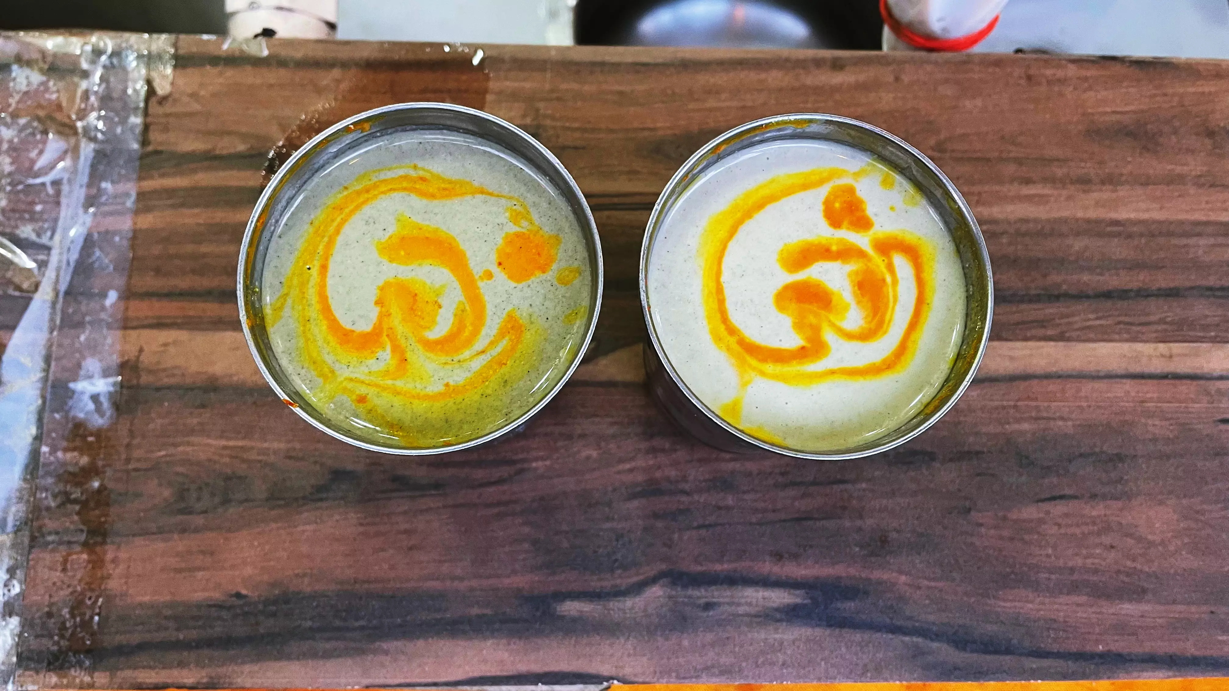 Glasses of thandai with Om written using saffron.