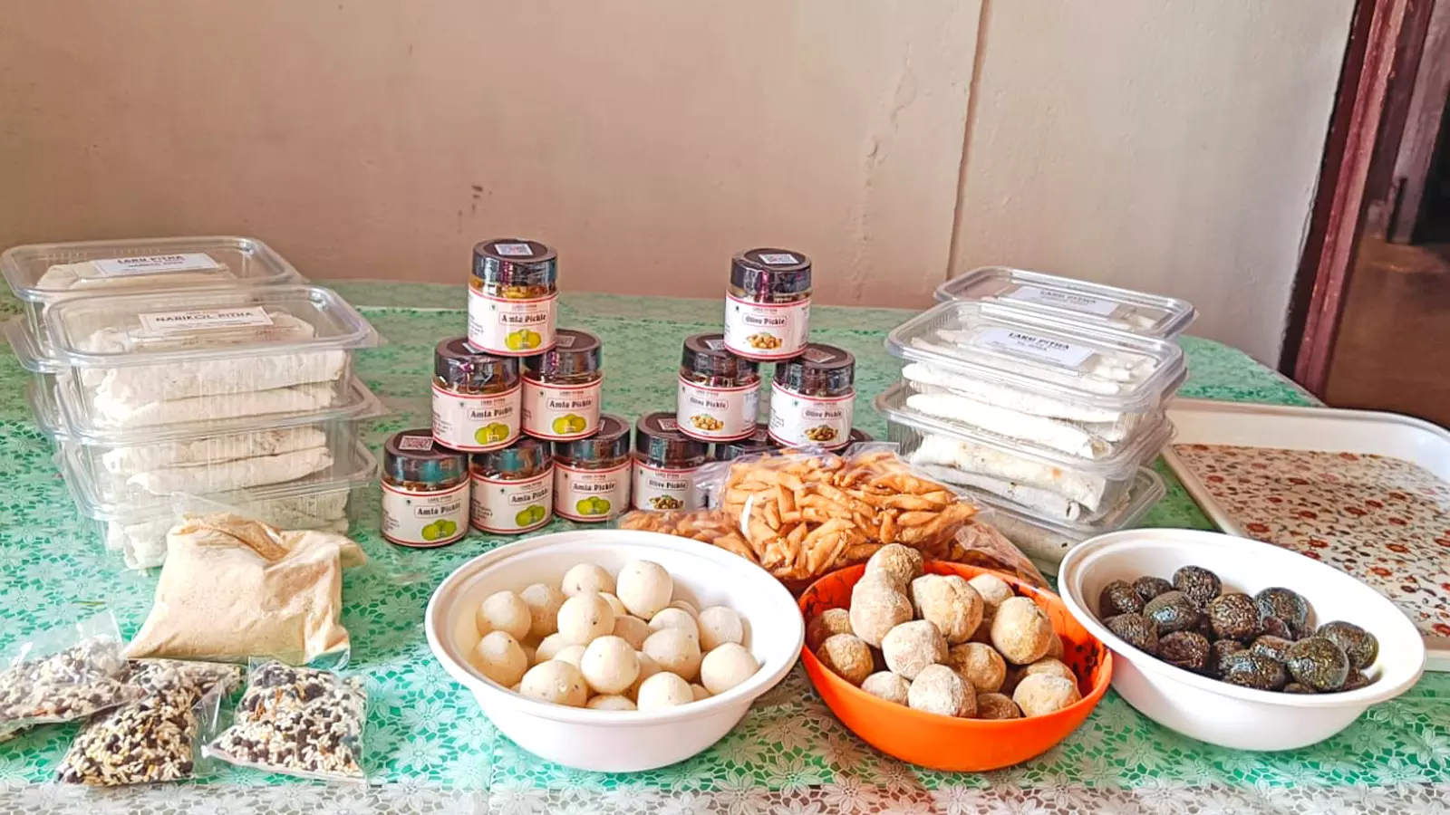 A Bhogali bihu feast: Laru, pitha, mah karoi, nimki and bhut jolokia pickles.