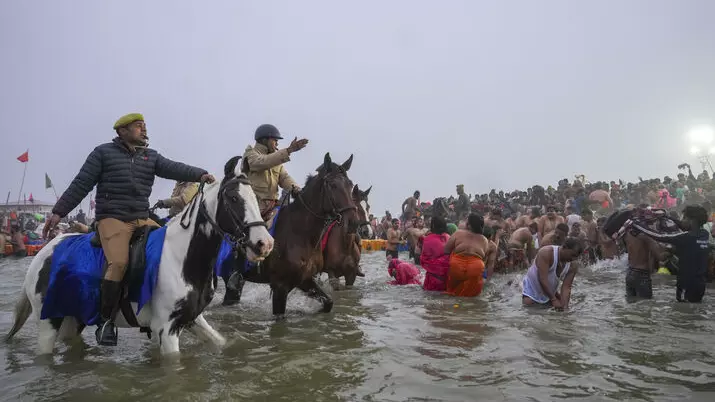 Devotees take holy dip in Sangam during Maha Kumbh mela