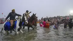 Devotees take holy dip in Sangam during Maha Kumbh mela