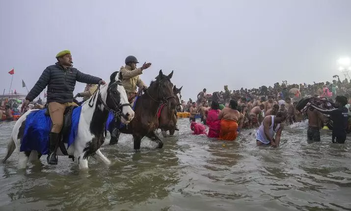 Devotees take holy dip in Sangam during Maha Kumbh mela