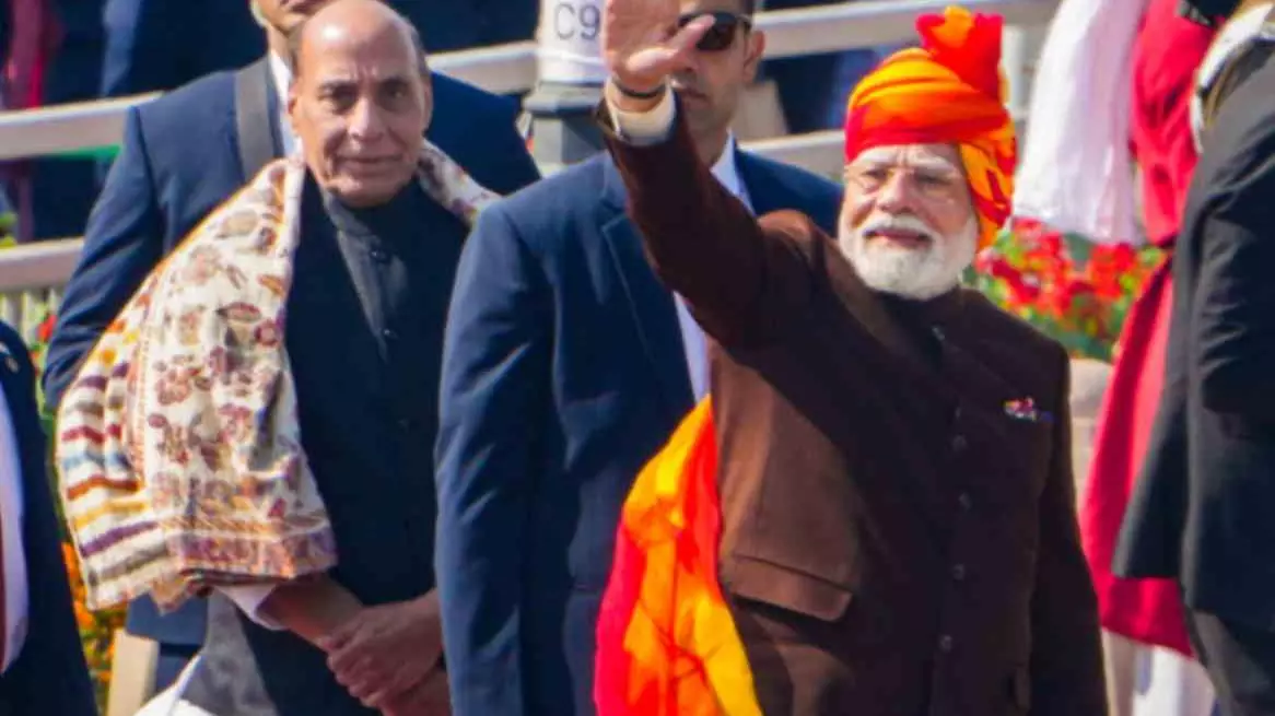 R-Day: PM Modi flaunts iconic turban look again, wears yellow-red striped safa R-Day: PM Modi flaunts iconic turban look again, wears yellow-red striped safa