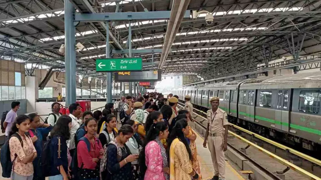Commuters at a Bengaluru Metro station