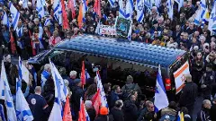 Hamas hands over 4 dead hostages as Palestinians leave Israeli prison