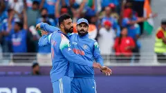 Varun Chakravarthy and Virat Kohli