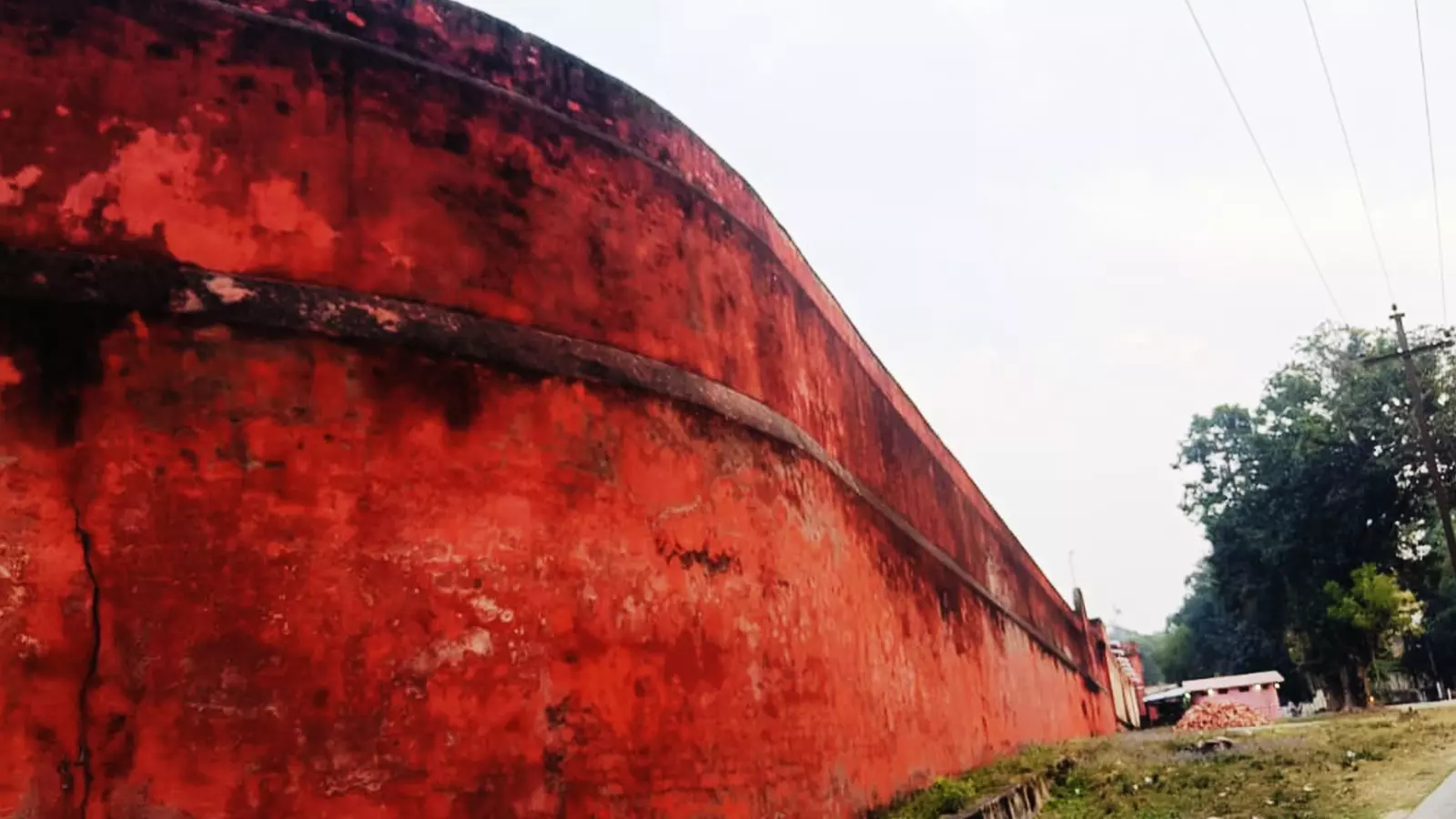 The red wall guarding the jail for ages.