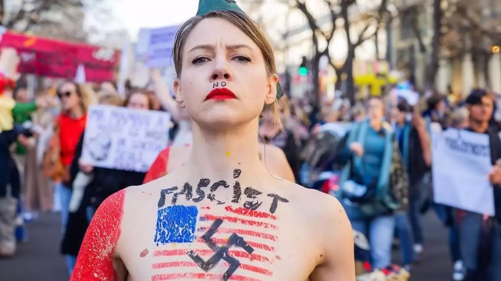 Topless women from radical feminist group march topless in Paris