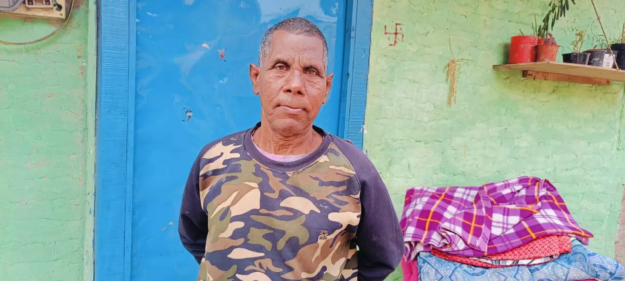 Biju Basfore, 50, a sanitation worker at the municipal corporation in Tezpur.