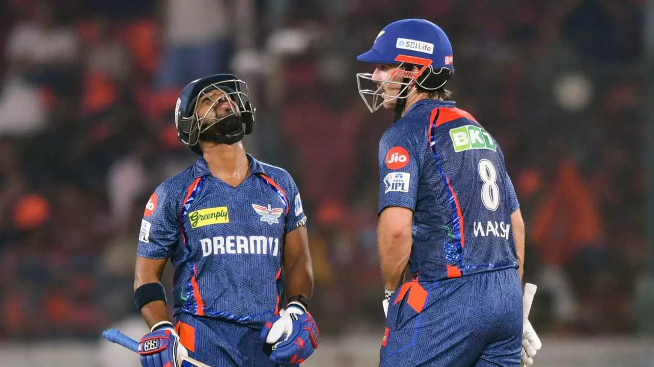 Lucknow Super Giants Nicholas Pooran, left, celebrates his half century with Mitchell Marsh