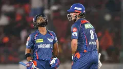 Lucknow Super Giants Nicholas Pooran, left, celebrates his half century with Mitchell Marsh